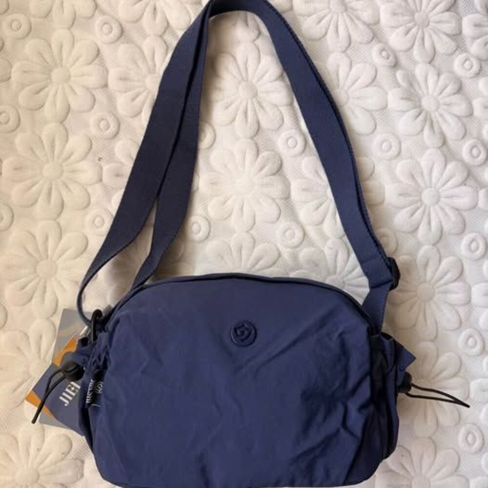 Lightweight, water-resistant, minimalist crossbody bag